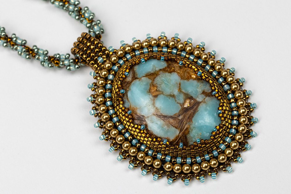 A necklace with beads and stones on it