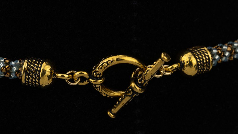 A close up of the chain on a black background