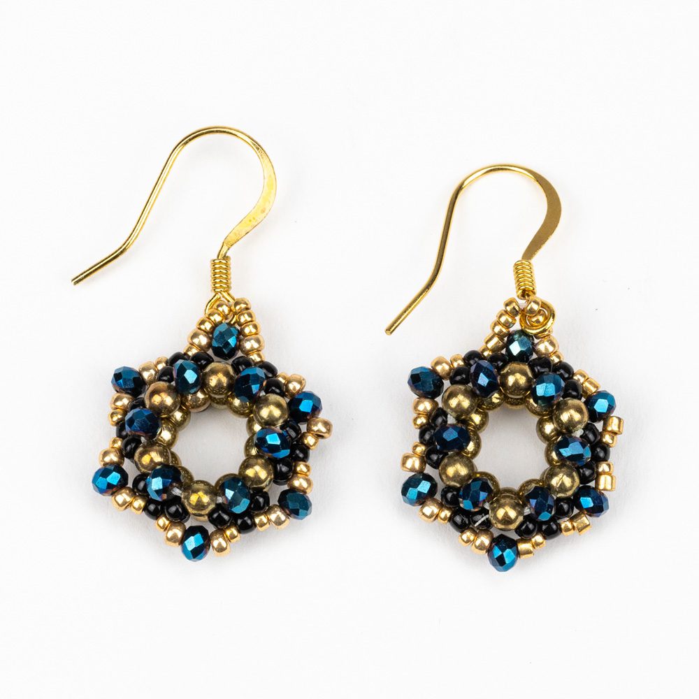 A pair of earrings with blue and gold beads.