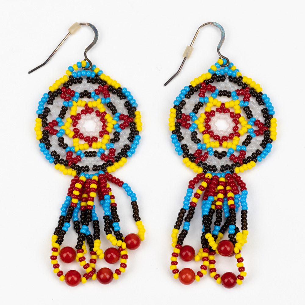 A pair of earrings made out of beads.