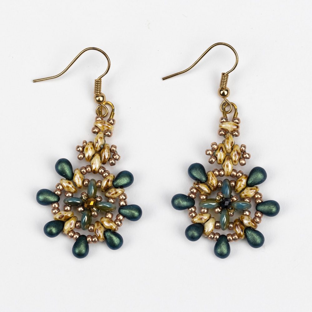 A pair of earrings with green and gold beads.