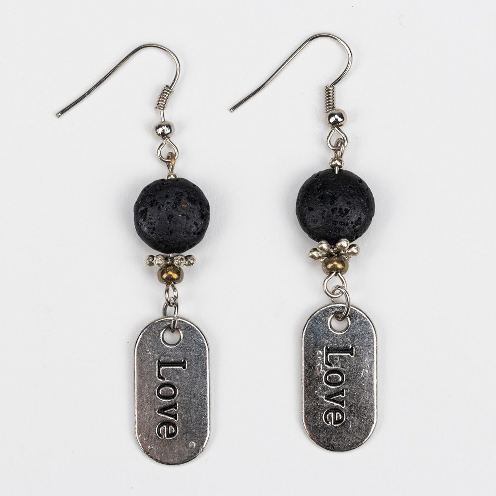 A pair of earrings with the word love on them.